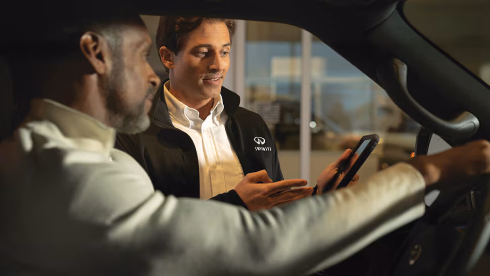 Infiniti representative demonstrating intouch services